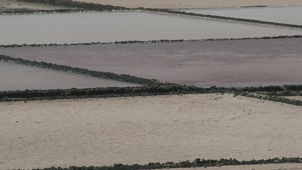 Salt extraction. Salinas de Janubio in Lanzarote alt