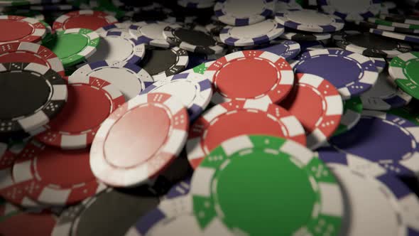 Jackpot. Casino chips formed a big pile on a gaming poker table. Loopable video alt