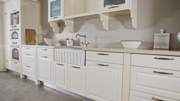 Tracking shot of a luxury kitchen with white classic design alt