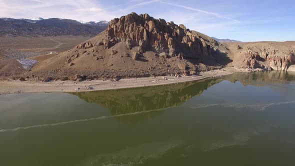 Flying over reservoir from one bang to the other towards rocky mountain alt