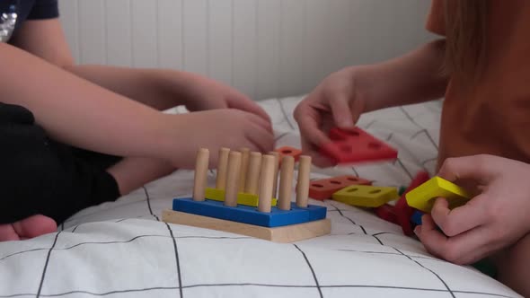Little Children Collect Wooden Educational Game Hands Close Up