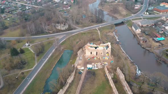 Medieval Castle the Town of Dobele on the West Bank of the River Berze in Winter. Aerial  alt