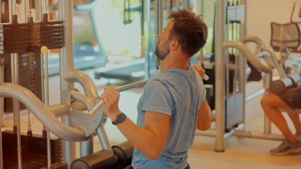 Indoor Pull-down Exercise. Fitness Workout Training. Pull Down Machine Biceps Muscles Exercises alt