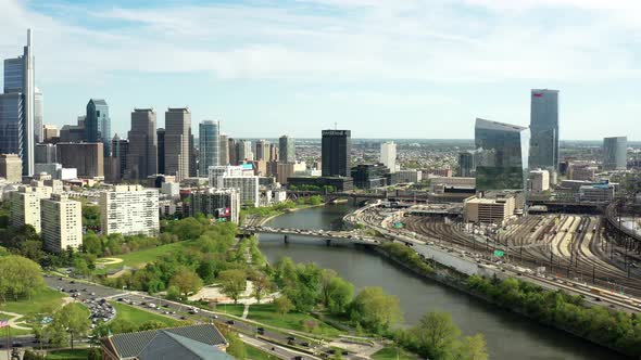 Aerial pan left of Philadelphia skyline at sunset from the Benjamin Franklin Parkway alt