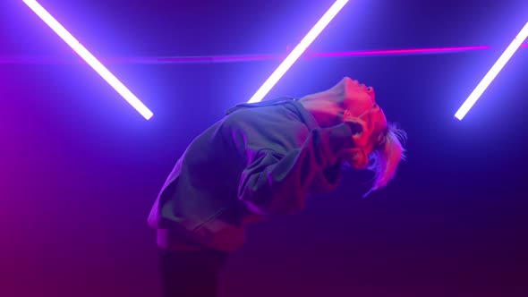 Cool Woman Performing Hip Hop in Neon Lights Close Up alt