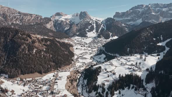 Dolly forward drone shot over Selva Wolkenstein valley dolomites alt