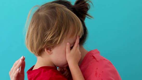 Woman Soothes Crying Son alt