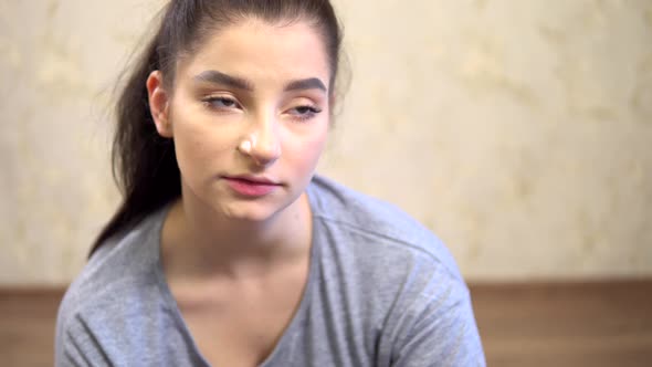 Tired Sad Depressive Young Woman Talking Close Up to Camera Sitting on Floor