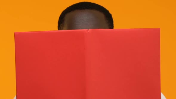 Shocked Male Student Eyeglasses Reading Book, Interesting Literature, Motivation alt