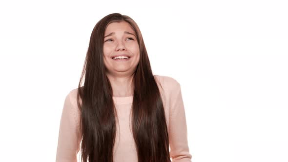 Portrait of Teen Woman with Very Long Brown Hair Refusing From Disgusting Thing with Smile alt