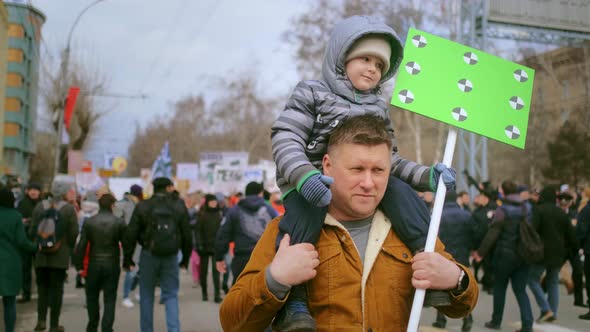 Dad and Kid at Political Rally for Animal Right