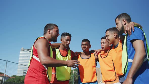 Soccer players planning strategy on the field alt