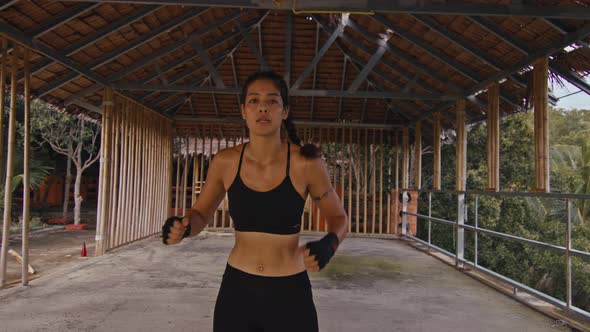 Woman Fighter Trains Her Punches Training Day in the Abandoned Hotel Strength Fit Body alt