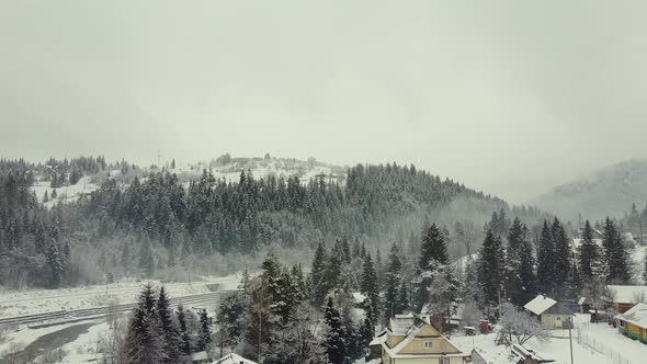 Drone View of Coniferous Forests on the Hills in Snow