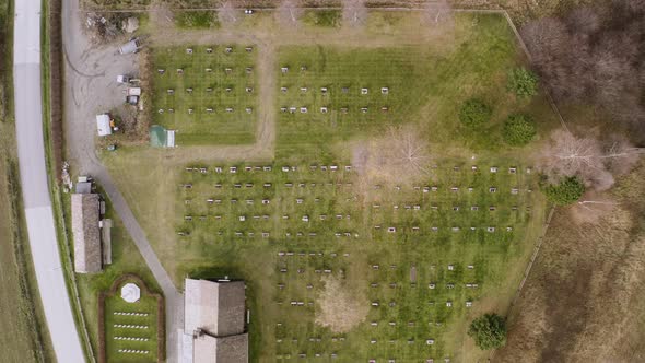 Bird's Eye View On Old Church With Graves In Sel, Norway - aerial drone shot alt