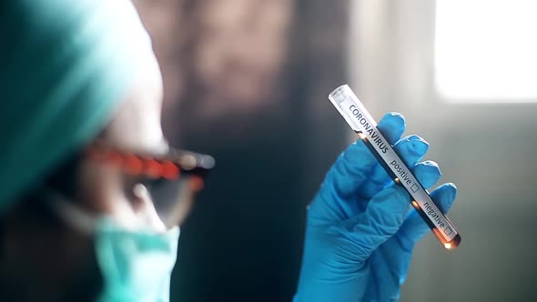 Doctor holding a coronavirus COVID-19 test tube