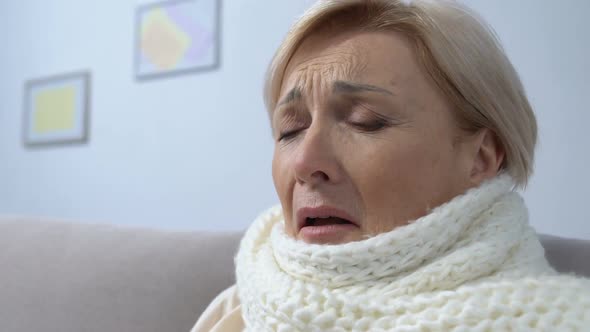 Old Lady in Scarf Suffering Flu Sneezing in Tissue, Seasonal Epidemic, Health