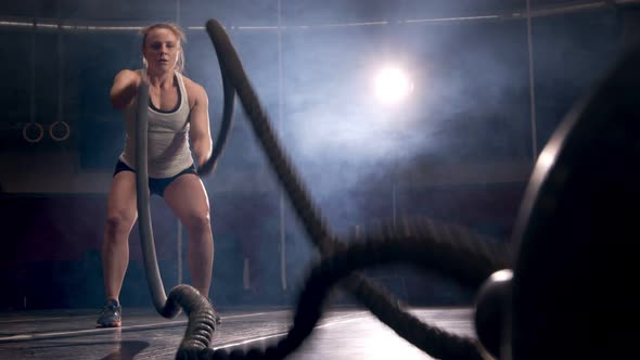 Fitness Female Athlete Training Using Battle Ropes Crossfit Workout Slow Motion