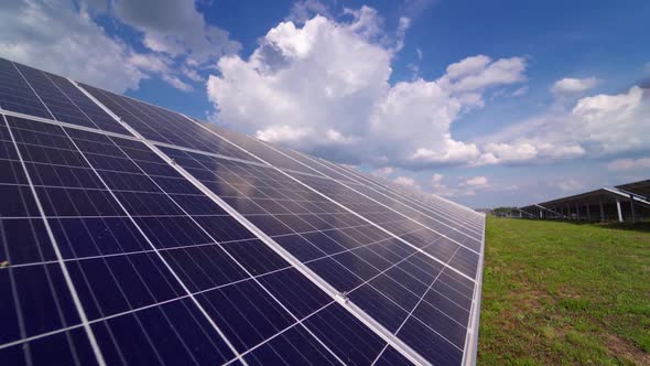 Long solar panel on field. Photovoltaic power supply system. alt