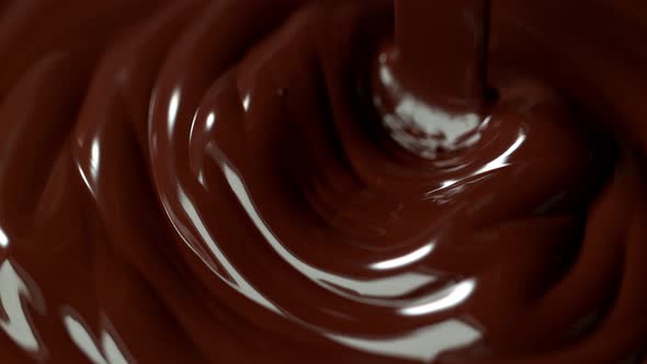 Super Slow Motion Shot of Pouring Melted Chocolate alt