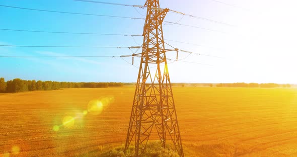 Vertical Movement Flight Near High Voltage Electricity Tower and Power Lines at Green and Yellow alt