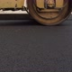 A Large Yellow Steamroller Flatten Hot Asphalt. Builds A New Road - VideoHive Item for Sale