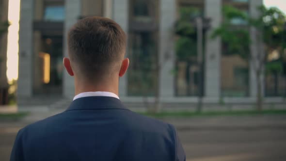 Male Business Person Crossing the Street alt