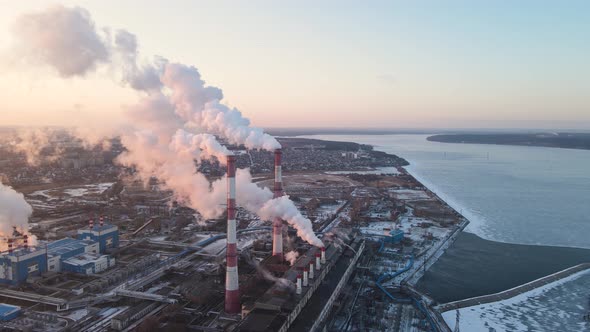 Aerial of factory chimney smoke building steam thermal power plant alt