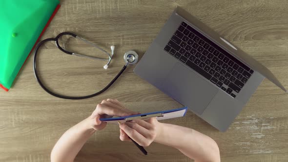 The Physician is Listening the Patient and Writing Symptoms