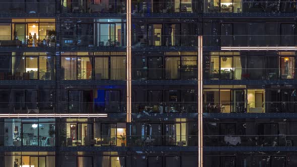 Flat Night Panorama of Multicolor Light in Windows of Multistory Buildings Aerial Timelapse alt