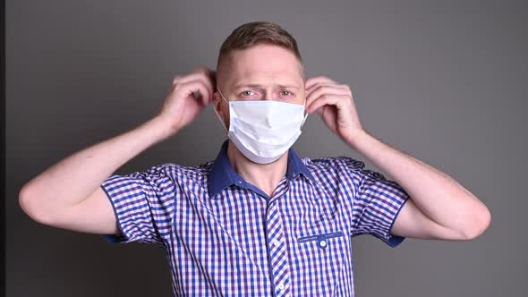 the man wears a protective medical mask. epidemic covid, fight against viruses