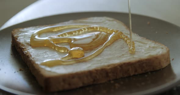 Honey on toast breakfast slow motion