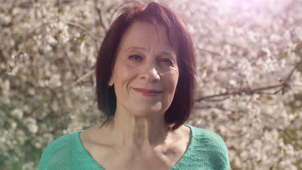 Mature Woman at the Garden at Spring alt