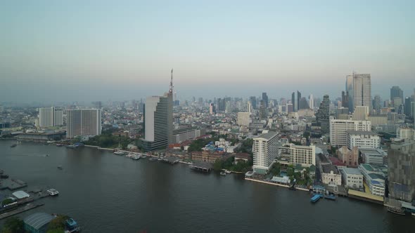 Time lapse of Bangkok City skyline by Chao Phraya River in Thailand. Financial district alt