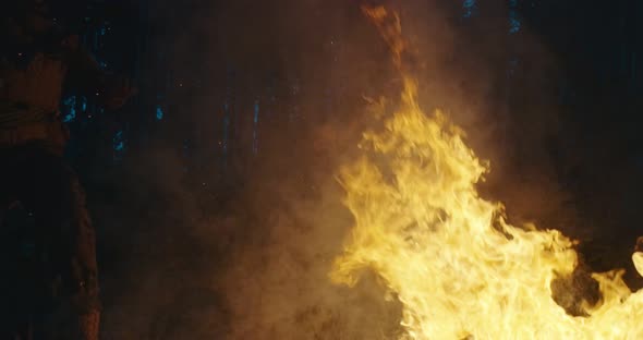 Military Operatives Going Thorugh Action and Juping Over Fire in Dense Forest at Night Concept of alt