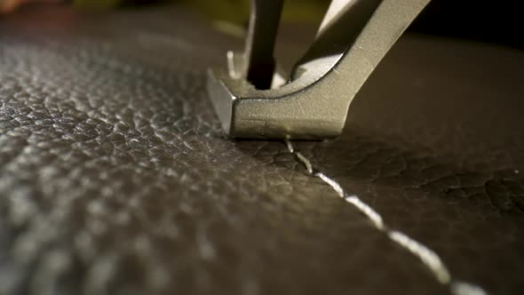 Seamstress Sews Woolen Fabric on Sewing Machine Advances Fabric with His Fingers alt