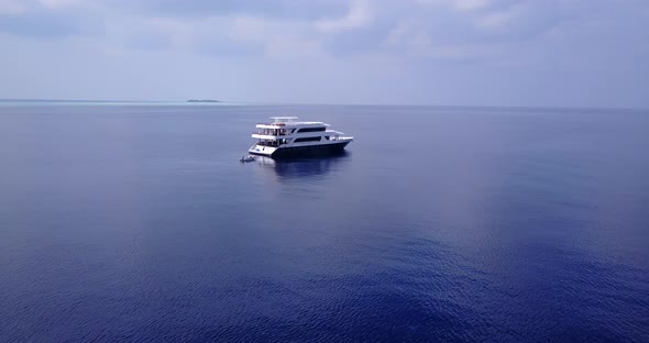 Tropical drone copy space shot of a sunshine white sandy paradise beach and blue water background in alt