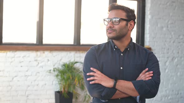 Headshot of Skilled Hindu Male Employee Standing with Arms Crossed alt