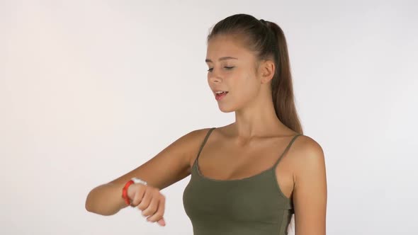 Beautiful Athletic Woman Checking Time on Her Sports Watch 1080p alt