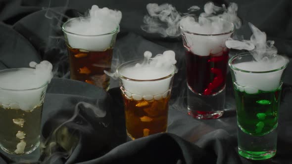 Many Colourful Alcohol Cocktails with Smoking Dry Ice