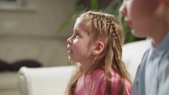 Little Girl Listens to Teacher By Brother at Private Lesson alt