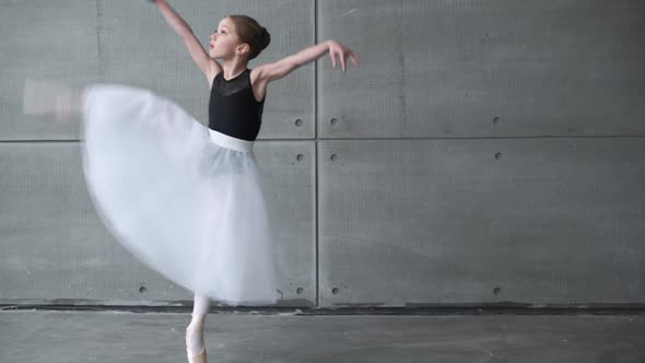 Elegant Little Girl in a Black and White Tutu Dress Dance Ballet and Perform Choreographic Elements alt
