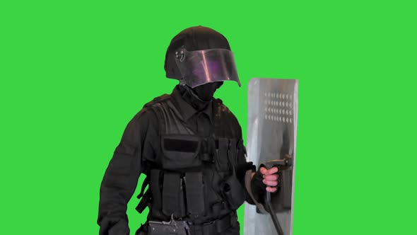 Riot Police Unit in Armor Baton Protective Shield Walking on a Green Screen Chroma Key alt
