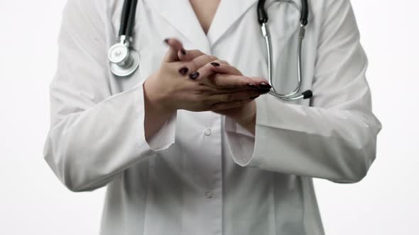 Close Up Female Doctor Wash Hands with Antibacterial Sanitizer, Antiseptic Use alt