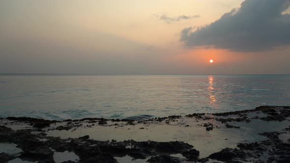 Sunset On The Stone Coast Of The Ocean alt