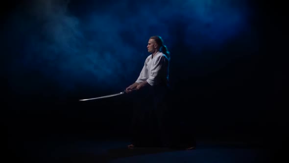 Men Fighting at Aikido Training with Japanese Sword Katana in Martial Arts School. Healthy Lifestyle alt