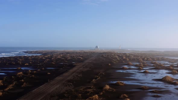 Drone Along Black Sand Beach Towards Stokksnes Observatory alt