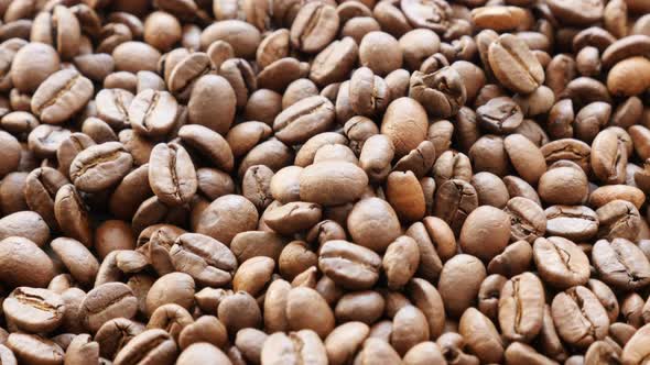 Many coffee beans food and drink  background  slow tilt 4K 2160p 30fps UHD video - Slow tilting over alt