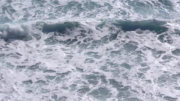 Rough sea waves splashing on the coast. alt