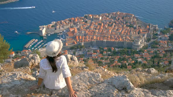 Woman Tourist Looking at City of Dubrovnik Croatia alt